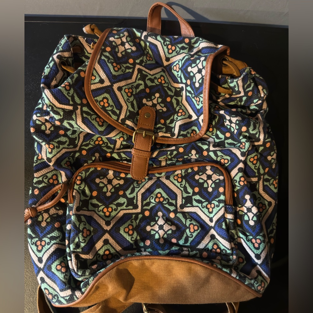 Patterned Backpack With Brown Accents - image 1